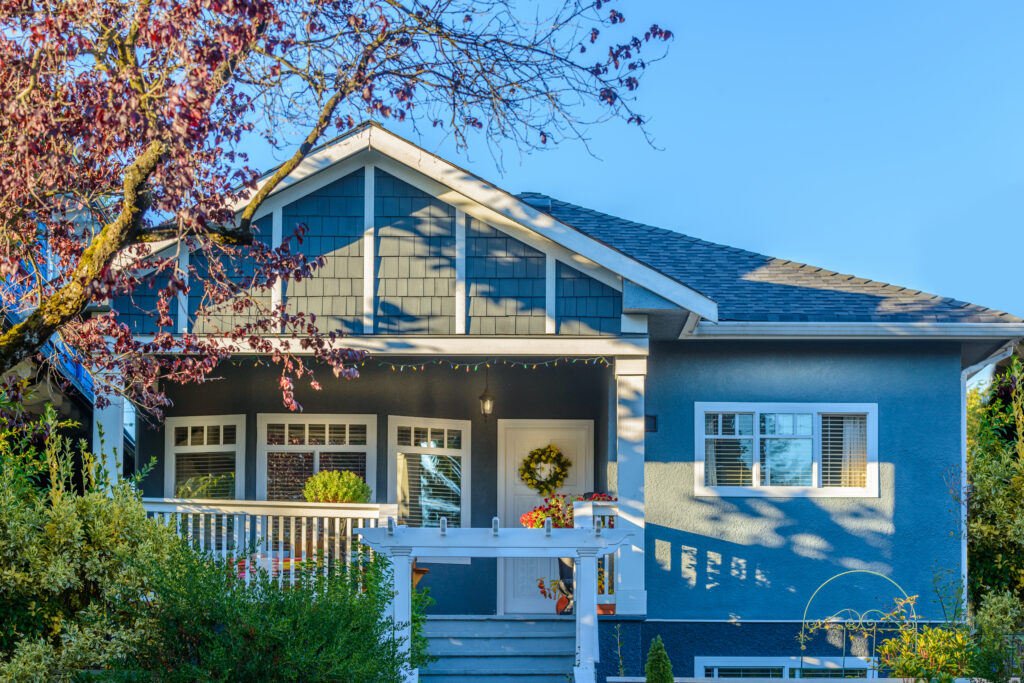 blue-house-with-autumnal-tree-and-white-trim-2026-03-26-11-36-46-utc